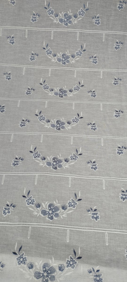 Horizontal cut Grecale glass curtain embroidered in blue