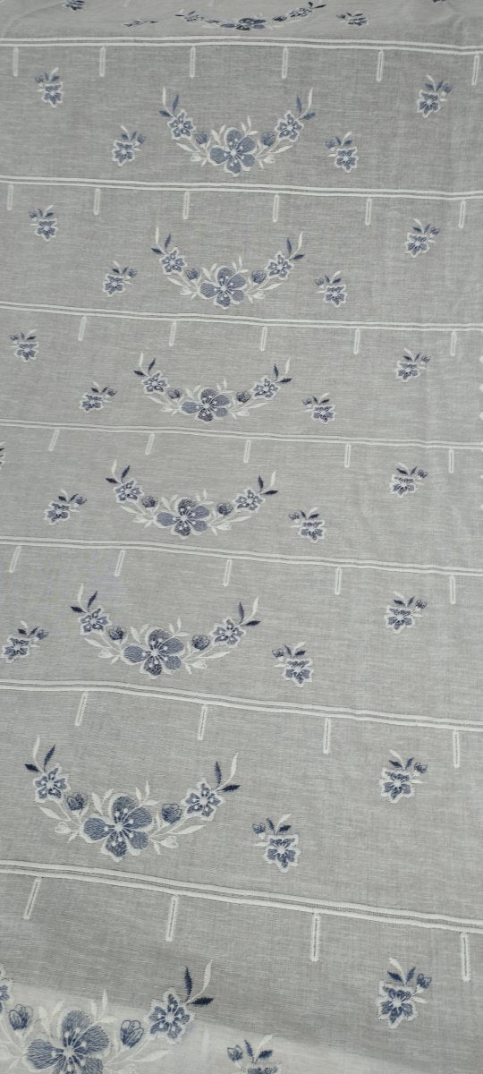 Horizontal cut Grecale glass curtain embroidered in blue