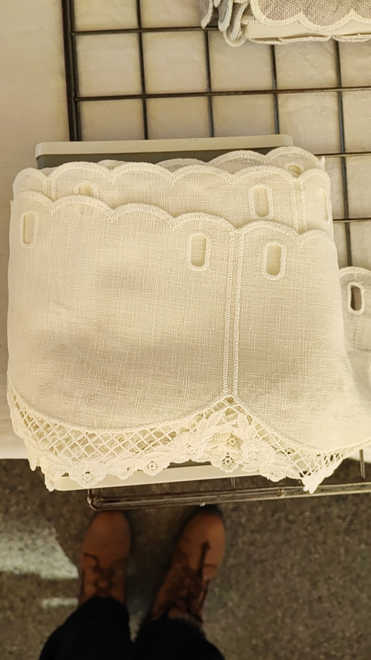 White valance with macramé at the bottom